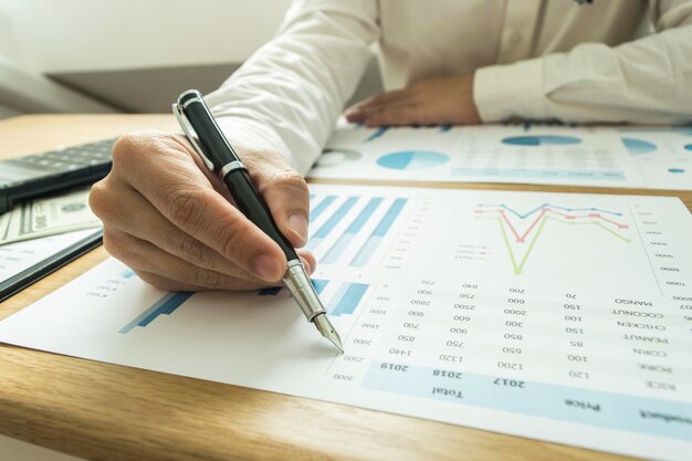 midsection man analyzing chart office desk 1048944 17585098