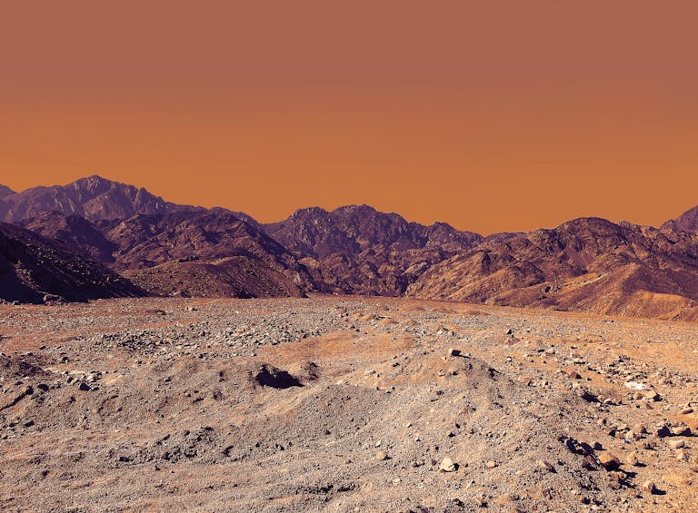 Vulputate Dignissim Suspendisse Inest Consequat Stunning landscape of South Sinai's rocky desert under a vibrant orange sky.