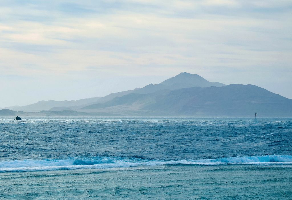A serene view of the Red Sea and distant mountains in Sharm El-Sheikh, Egypt.
