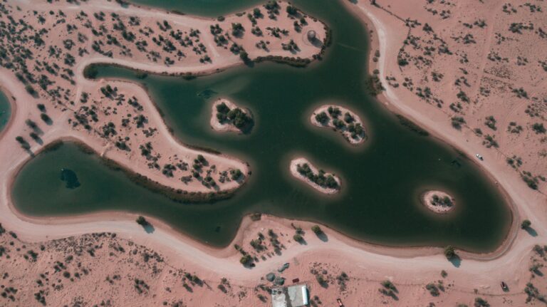 Nature-Based Solutions in the Arab Region: A Regional Framework for Climate Resilience and Sustainable Development A striking aerial view showcasing the natural lakes surrounded by desert landscape in Dubai, UAE.