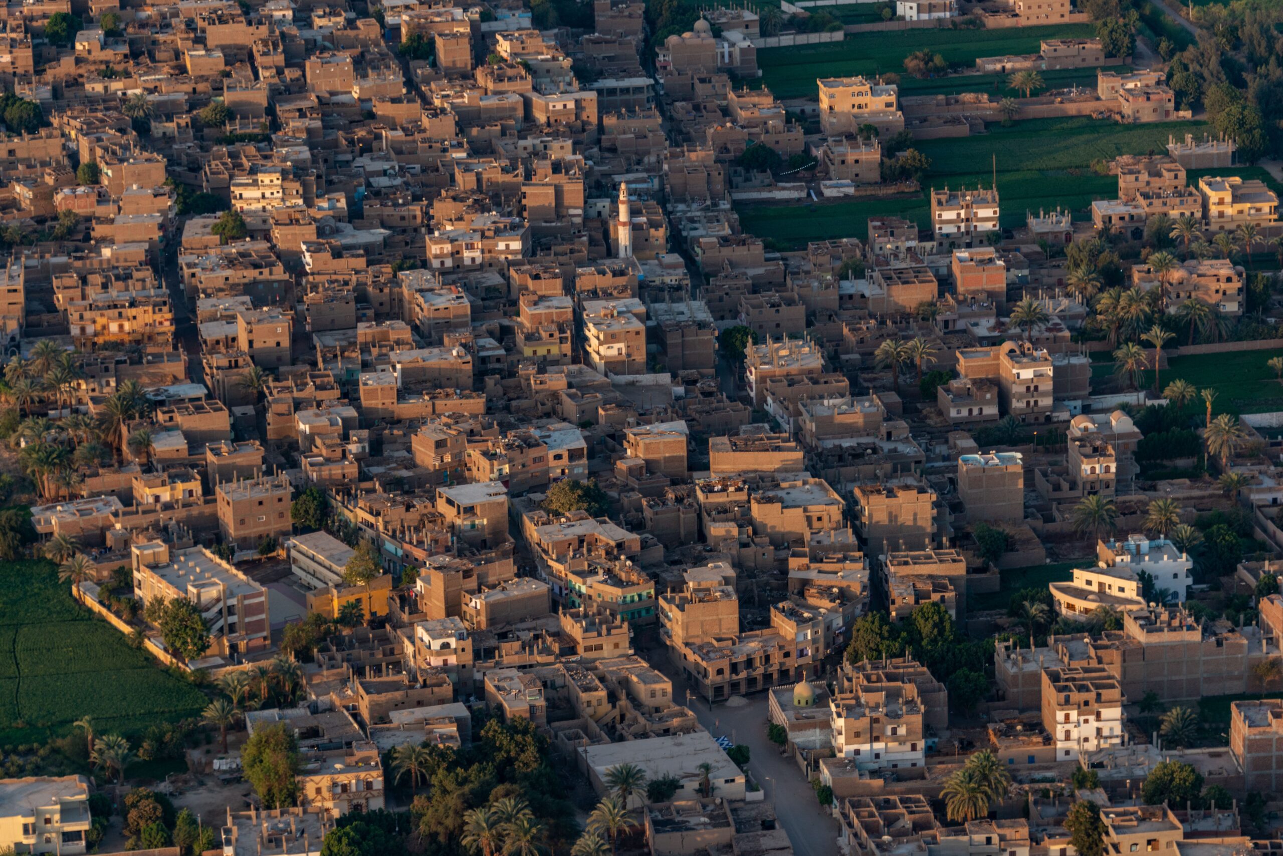 Strategic Environmental Assessment of Governorate Strategic Plans, Egypt Aerial shot of a densely packed Middle Eastern town with traditional buildings.